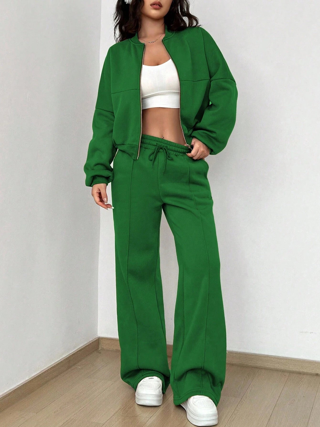 Green tracksuit and white crop top from Trendy Cardigan Two Piece Set for stylish fashion