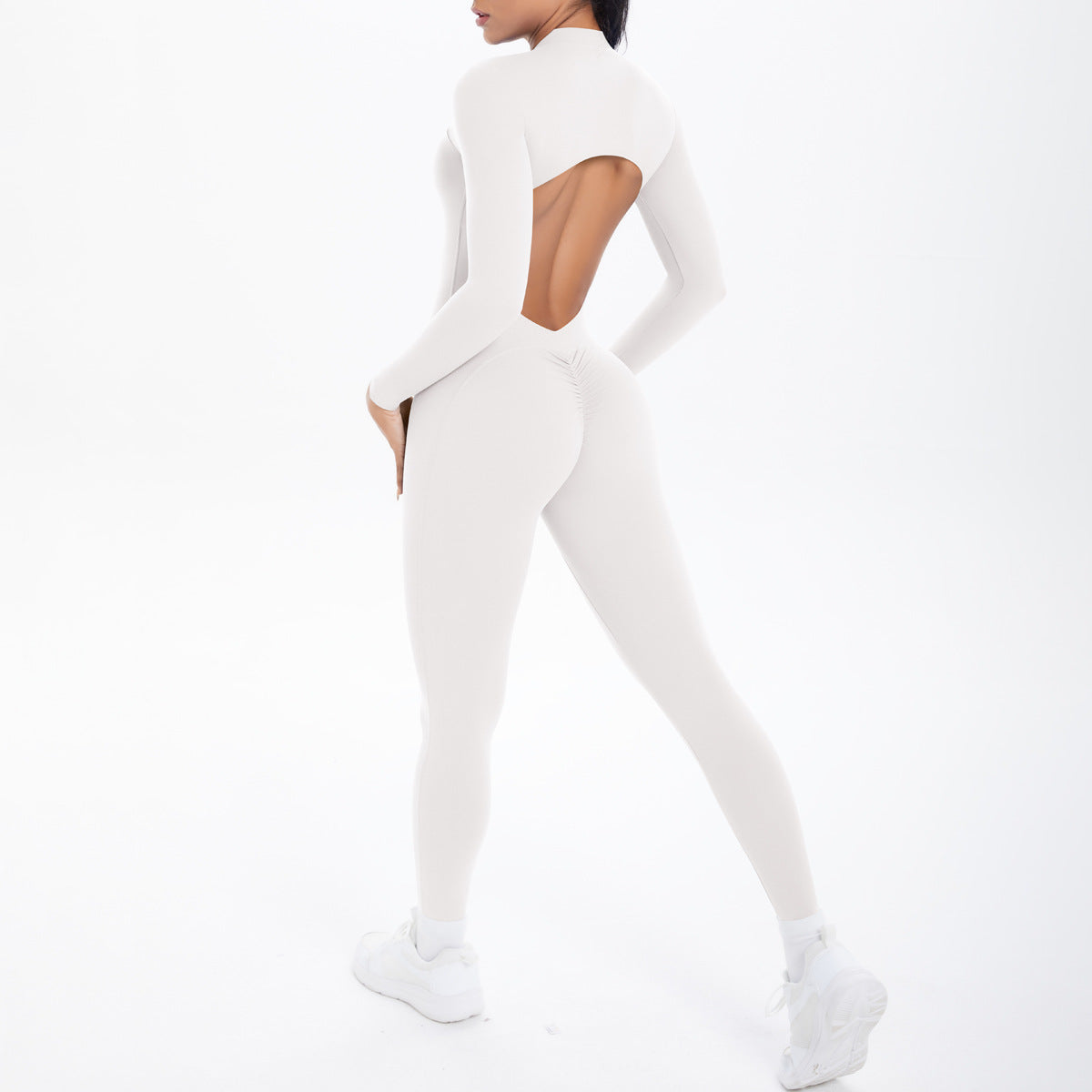 White long sleeve yoga top with back cutout and matching leggings