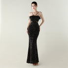 Black sequined mermaid langry dress with ostrich feather accents