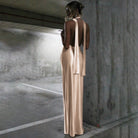 Elegant Halter Backless Ribbon Split Dress featuring a glamorous champagne-colored gown