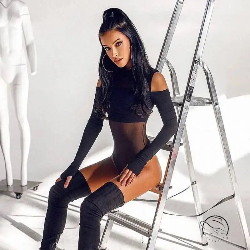 Model in gorgeous mesh stitching jumpsuit posing on ladder