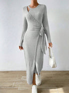 Warm knitted gray maxi dress with long sleeves and wrap tie