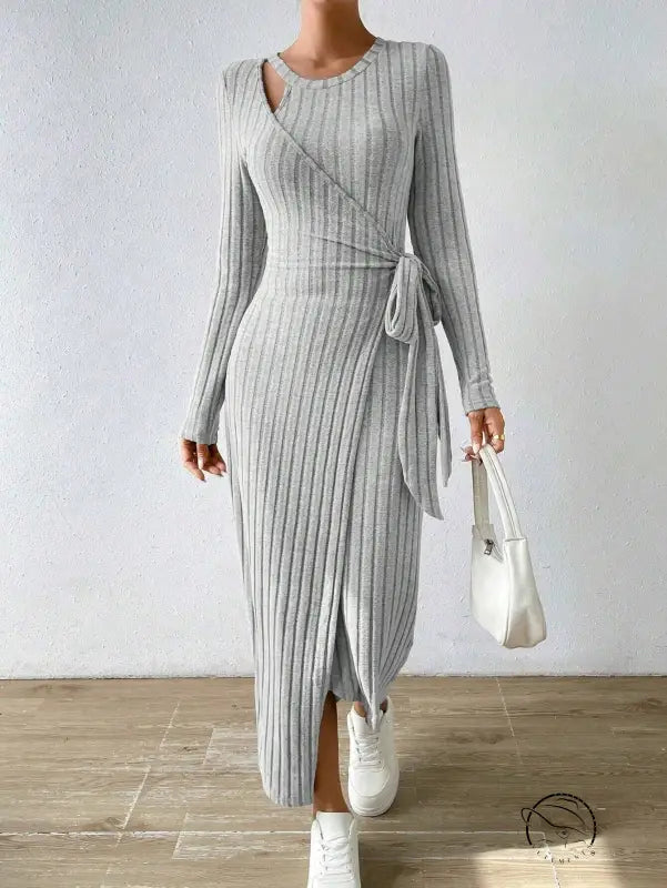 Warm knitted gray maxi dress with long sleeves and wrap front