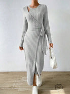 Warm knitted gray maxi dress with long sleeves and wrap front