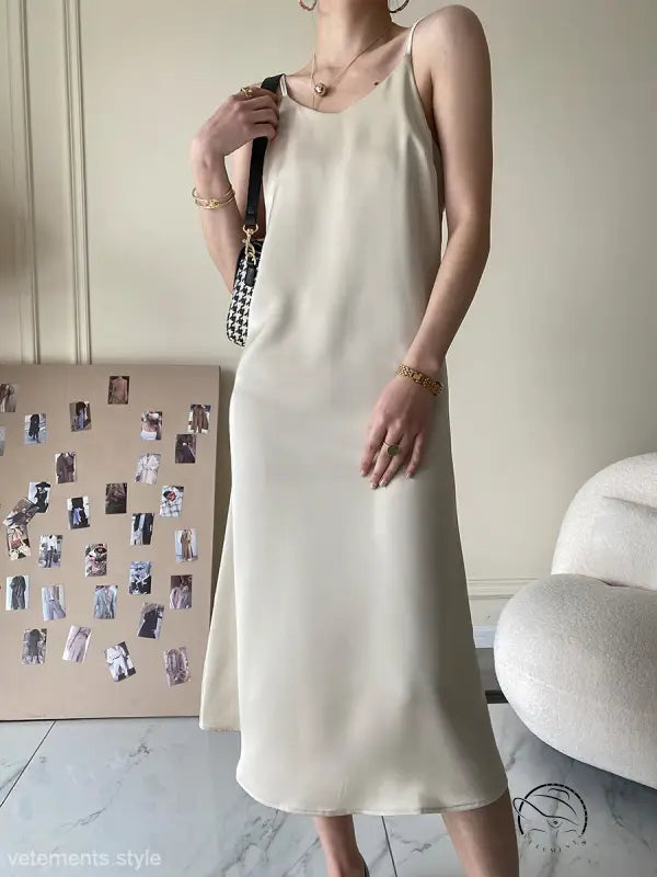 Cream-colored acetate satin dress in minimalist sleeveless midi design