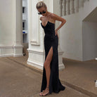 Sleek black spaghetti-strap Gorgeous Bare Back Split Dress, perfect for elegant fashion moments