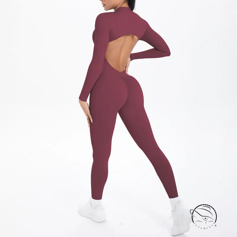 Maroon long sleeve yoga jumpsuit with back cutout and high-waisted leggings