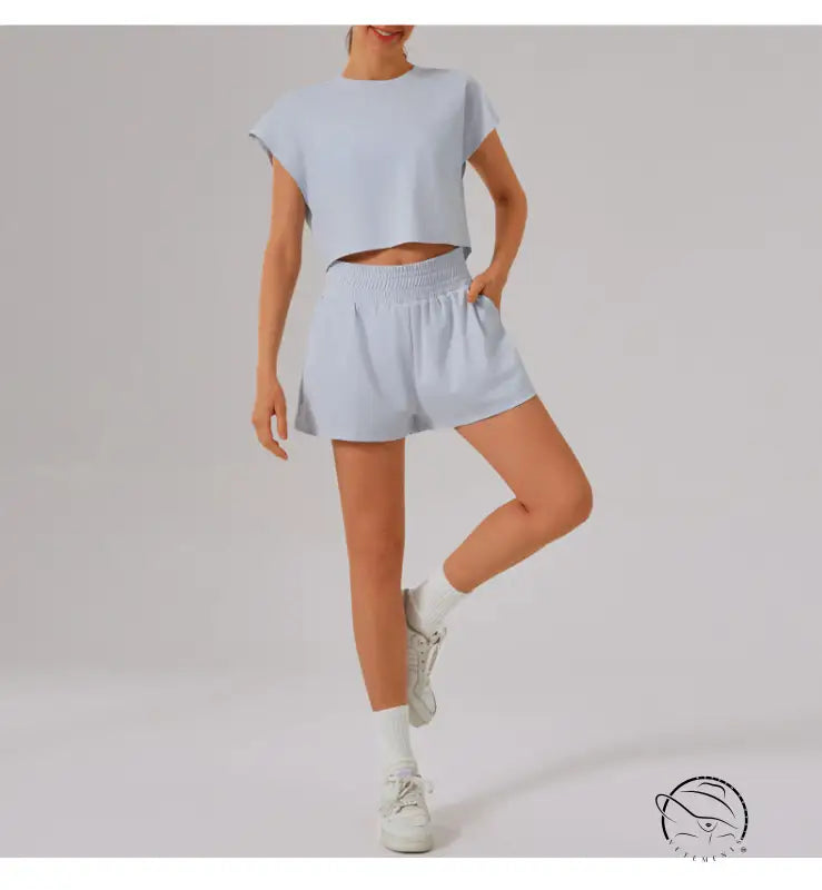 Light blue loose sports yoga fitness set with white sneakers