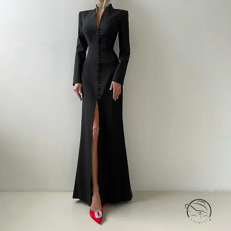 Langry black satin evening gown with high slit, long sleeves, red heels
