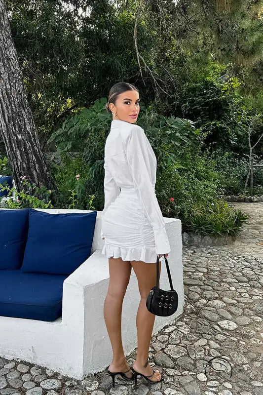 Elegant woman in stunning white cotton linen langry fashion dress