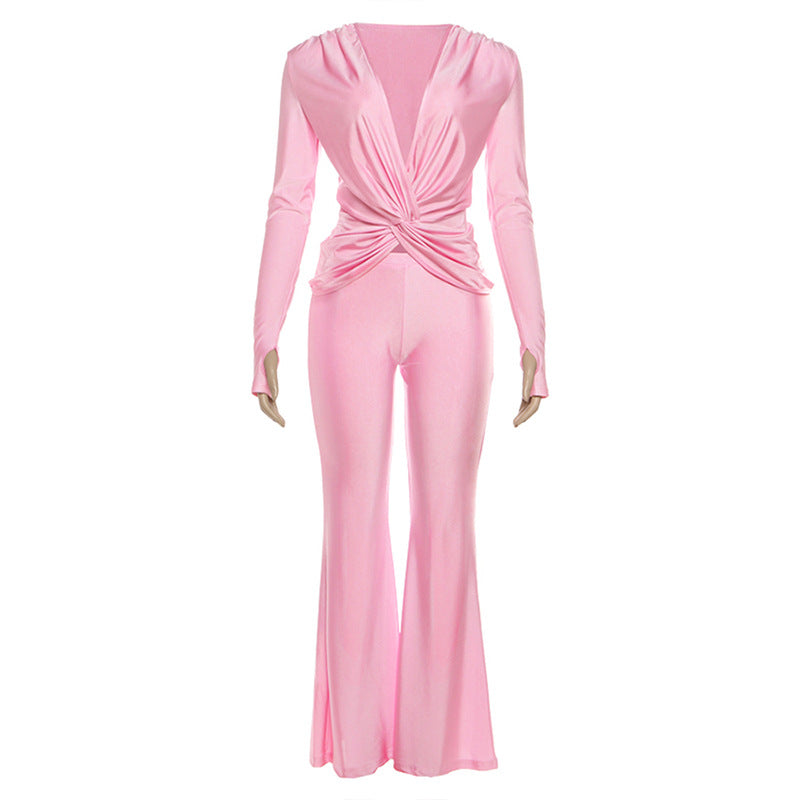 Pink satin long sleeve jumpsuit with front twist and high waist design