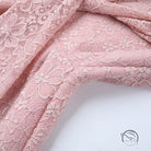 Elegant dusty rose lace jumpsuit with floral pattern for bridal fashion