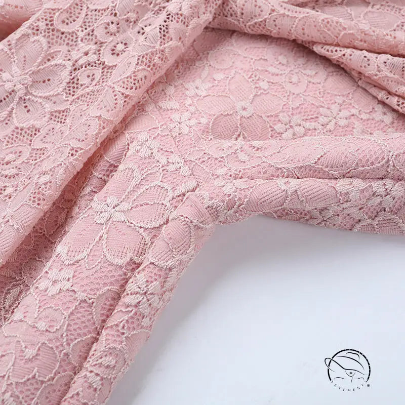 Elegant dusty rose lace jumpsuit with floral pattern for bridal fashion