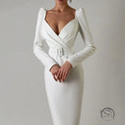 Elegant white langry wrap dress with puff shoulders and belted waist