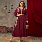 Burgundy long-sleeved A-line dress with gold embroidery and cinched waist