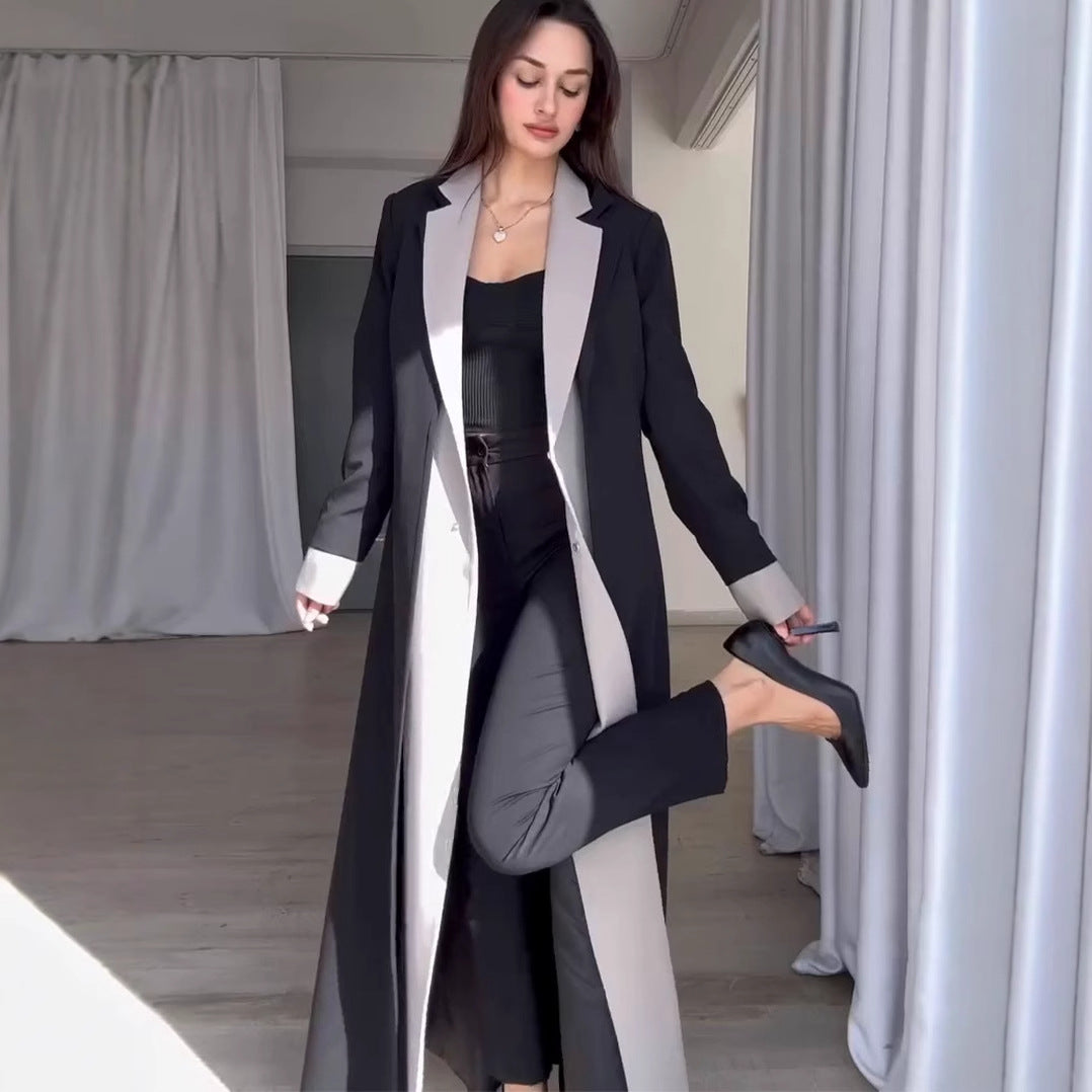 Long contrast color trench coat with collar stitching in black and gray wool