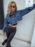 Women’s dark blue cropped matching denim short coat with distressed details