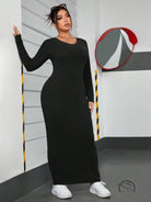 Black ribbed maxi dress in winter minimalist slim fit sheath style