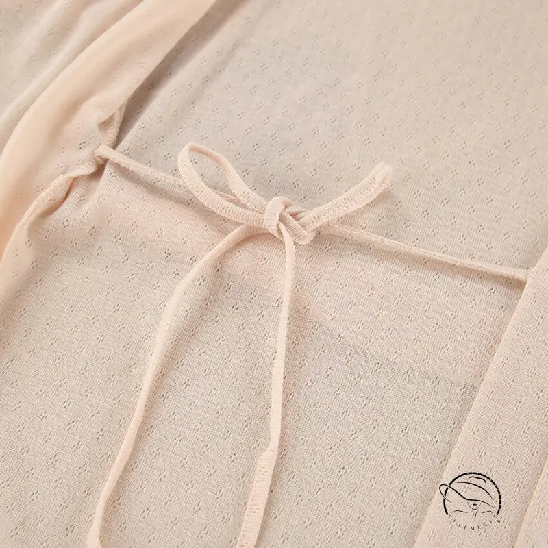 Delicate beige lace langry fashion dress with dotted pattern and bow neckline