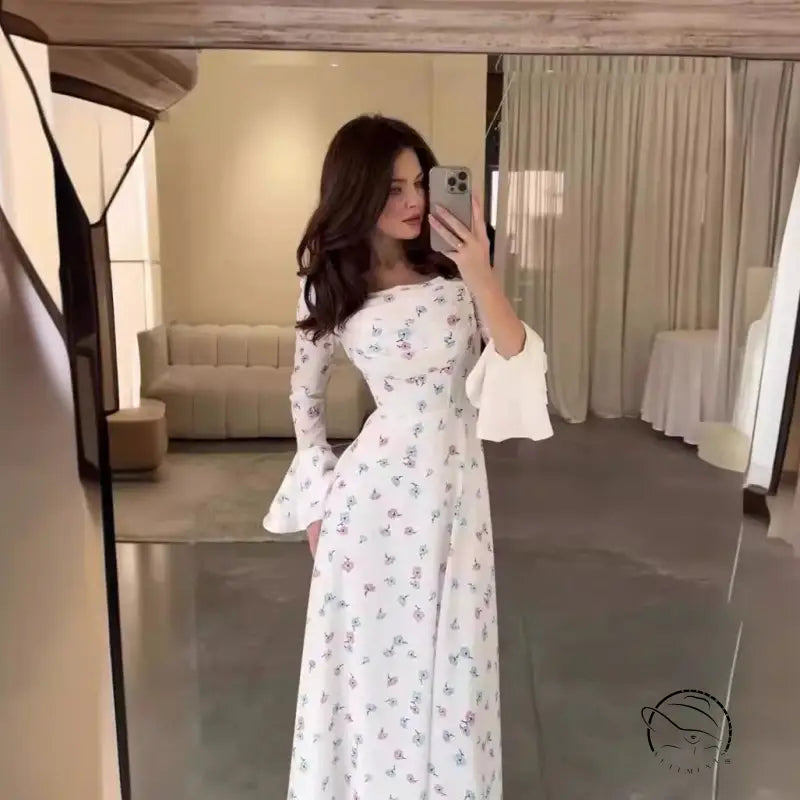 Elegant floral white dress with flared sleeves in summer fashion