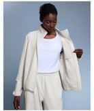 Langry cream-colored textured blazer with high collar, pockets, waterproof fashion coat