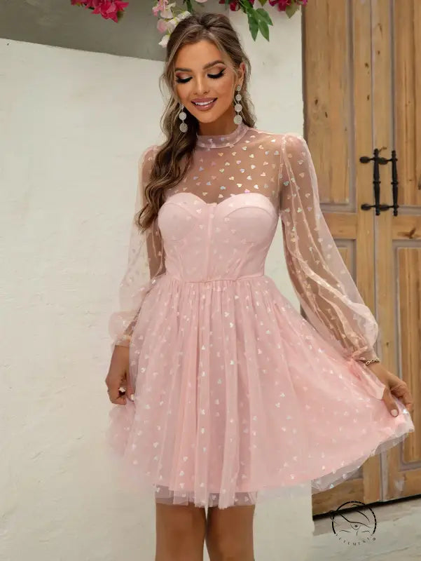 Elegant Barbie dress in pink tulle with polka dot sleeves
