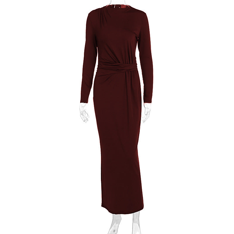 Sleek burgundy long-sleeved maxi dress with fitted waist tie