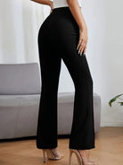 Black flared dress pants with high waist for women, perfect for casual fashion looks