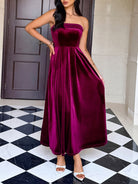 Elegant burgundy velvet strapless maxi dress with pleated skirt and high slit in Langry fashion