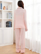 Pink long-sleeved pajama set with black piping for women, stylish langry fashion ملابس