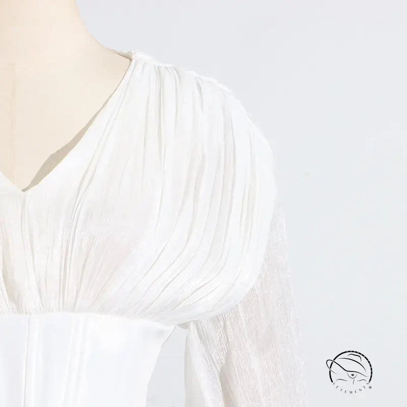 White langry fashion blouse with ruffled sleeves and v-neckline