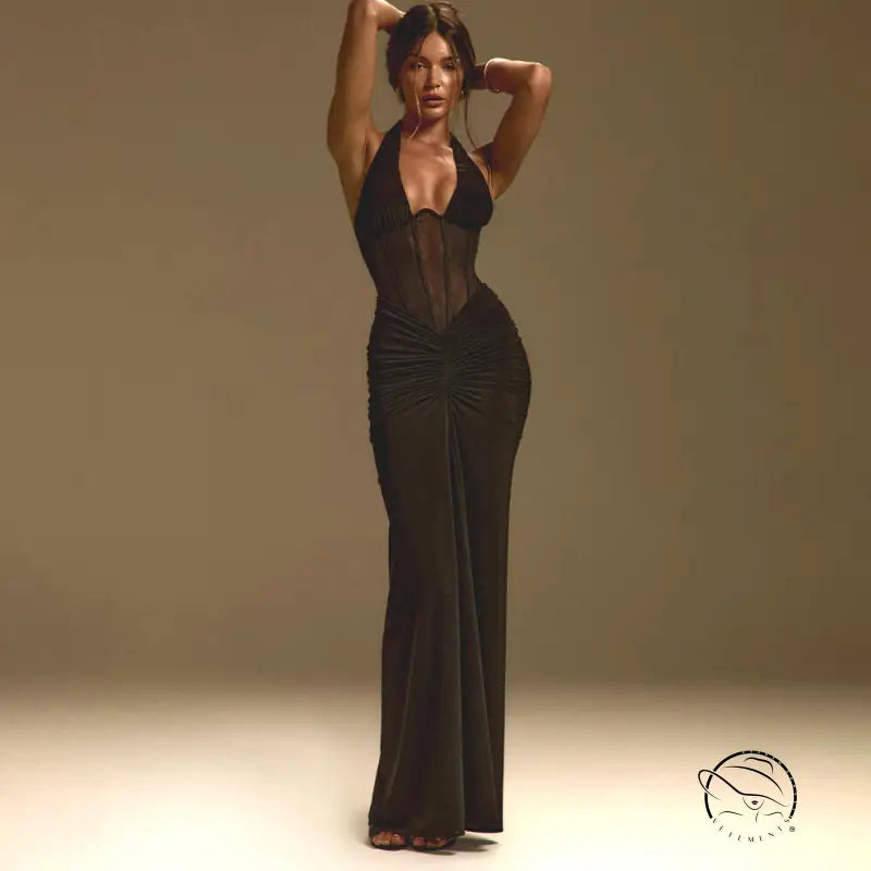 Elegant black halter-neck maxi sheath dress in langry fashion with sheer panels and lace hem