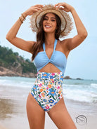 Stunning light blue halry piece swimsuit with floral bottoms and straw hat