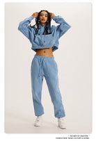 Light blue cropped hoodie and sweatpants loungewear set for stylish winter fashion ملابس