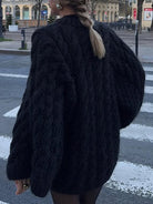 Black fur long sleeve coat with cable knit texture and pearl buttons