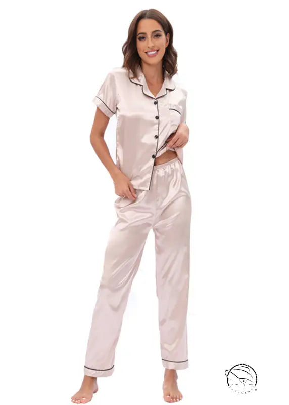 Langry rose gold satin pajama set with black piping and buttons
