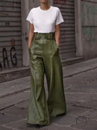 High-waisted faux leather bell bottom pants in olive green