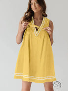 Beautiful embroidered vest denim dress in yellow with white trim