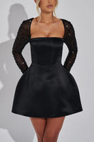 Black satin mini dress with beaded sleeves for stylish casual meetings in fashion ملابس