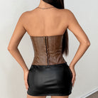 Langry fashion brown faux leather underbust corset with gold accents and black mini skirt