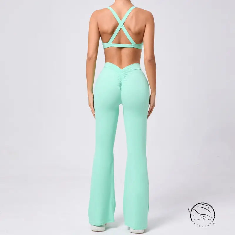 Peach tight brushed yoga clothes set with mint green flared pants and crisscross back sports bra
