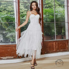 White tiered tulle french tube dress with yarn straps and large swing