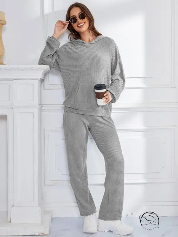 Woman in gray ribbed hooded casual suit lounge set