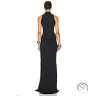 Black halter neck maxi dress with tight waist, high split, ruched detailing, and silver hardware