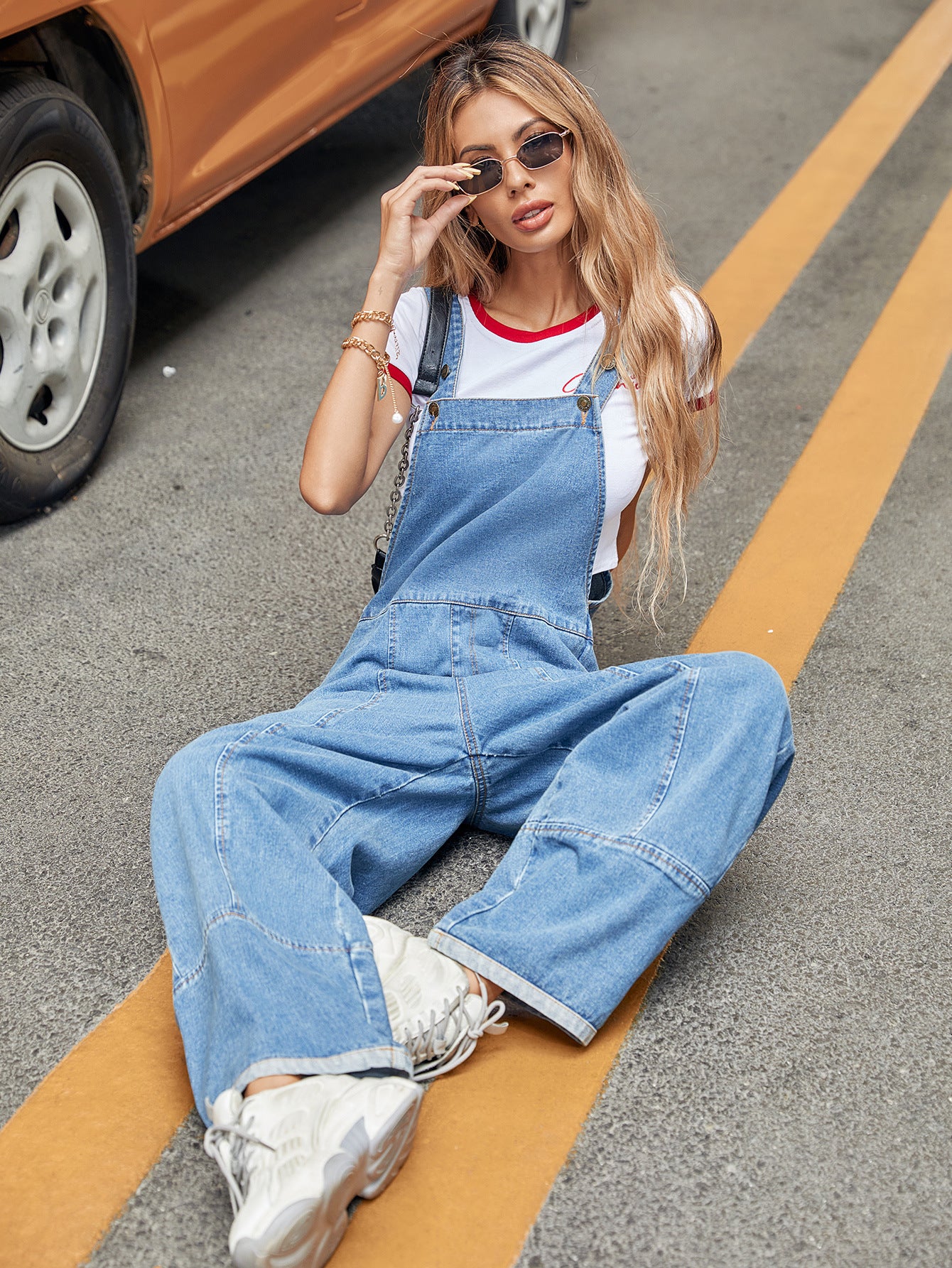 Casual Denim Jumpsuit paired with sneakers for trendy langry fashion ملابس