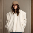 Woman in a fuzzy white zip-up jacket from Langry’s stylish Berber fleece coat collection