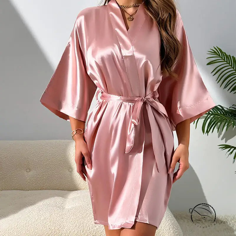 Woman in pink satin kimono robe from comfy shorts home wear set