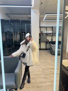 Langry faux fur mid-length jacket with cream fur, black trim, white pom-pom hat