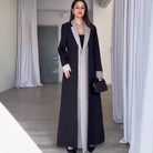 Black and white long trench coat with collar stitching and contrast color