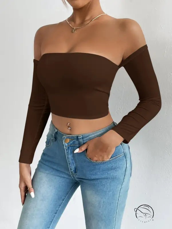 Woman in off-shoulder camisole waist trimming short sleeve crop top